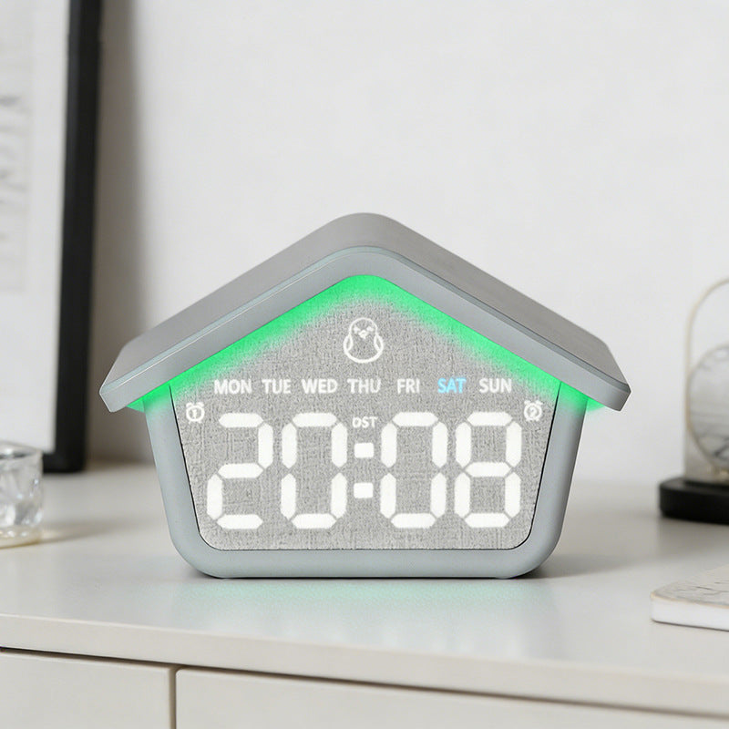 Digital alarm clock in creative house design Bowlift