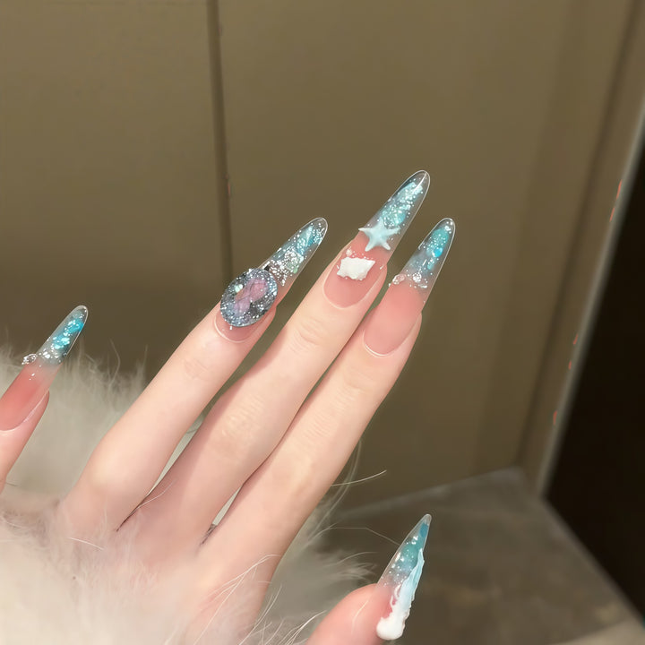 Creative artificial nails with maritime designs and sparkling accents Bowlift