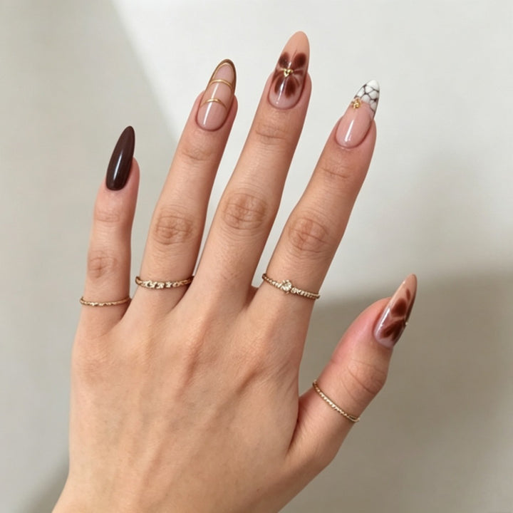 Artificial nails with elegant marble pattern and delicate accents Bowlift