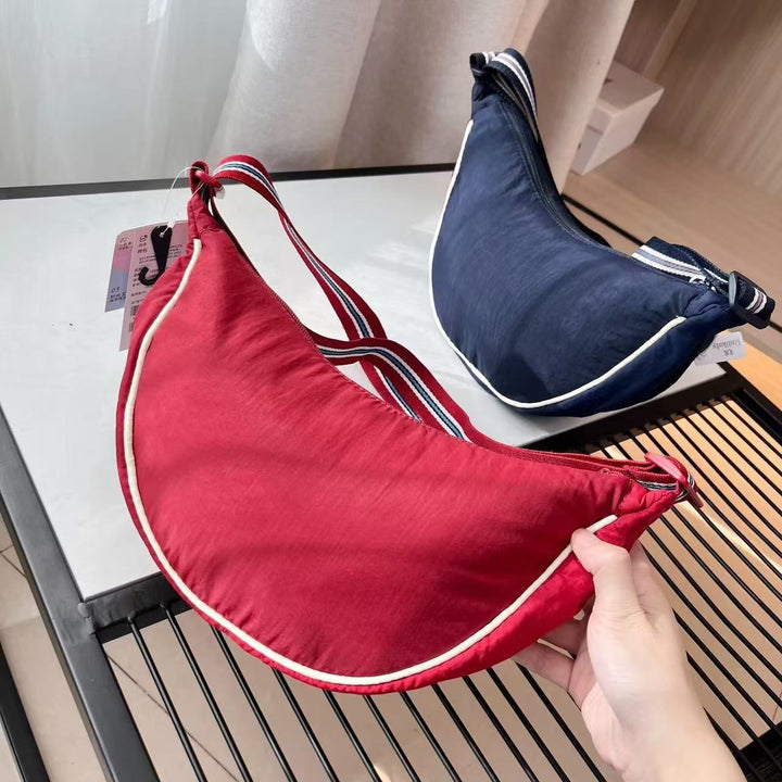 Shoulder bag with adjustable shoulder strap and versatile interior compartment Bowlift