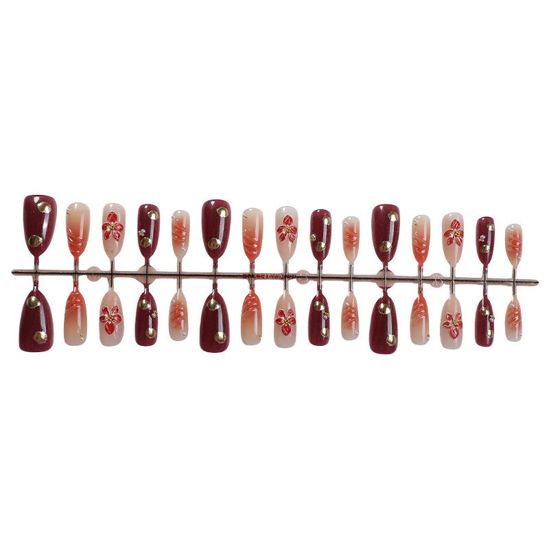 Acrylic nail set with elegant floral accents and glitter details Bowlift