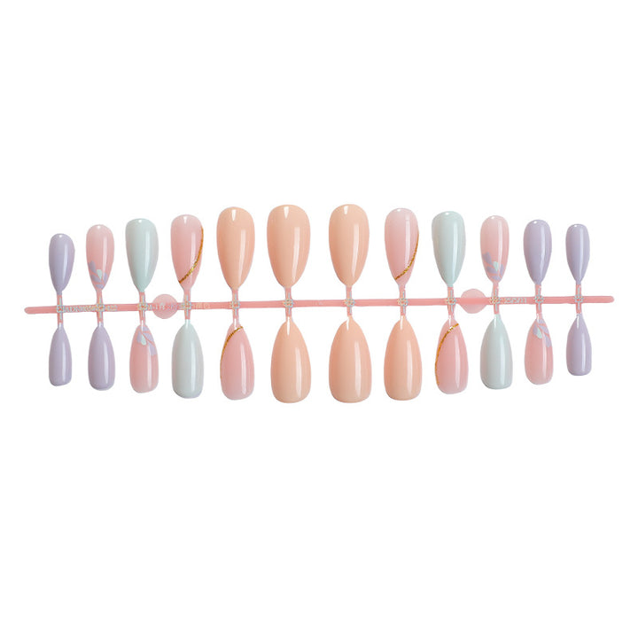 Artistic Press-On Nail Set with Gold Accent Designs Bowlift
