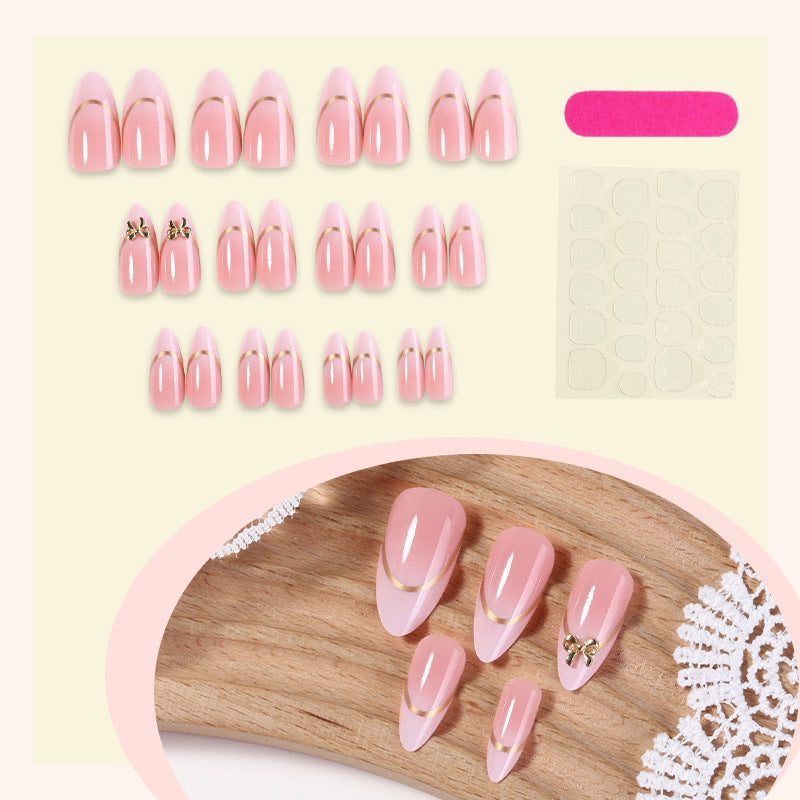Artificial nail set with elegant gold edge and decorative accents Bowlift