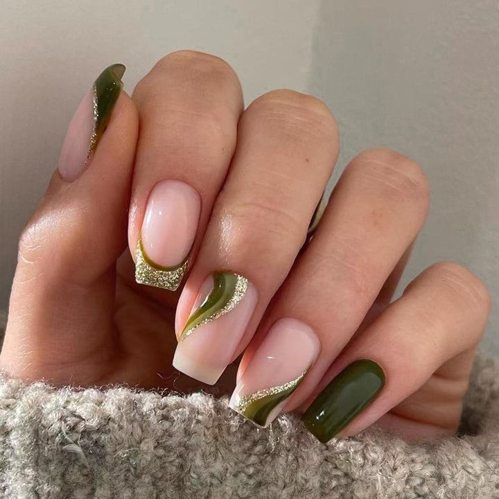 Artful nail extensions with golden accents and elegant design Bowlift