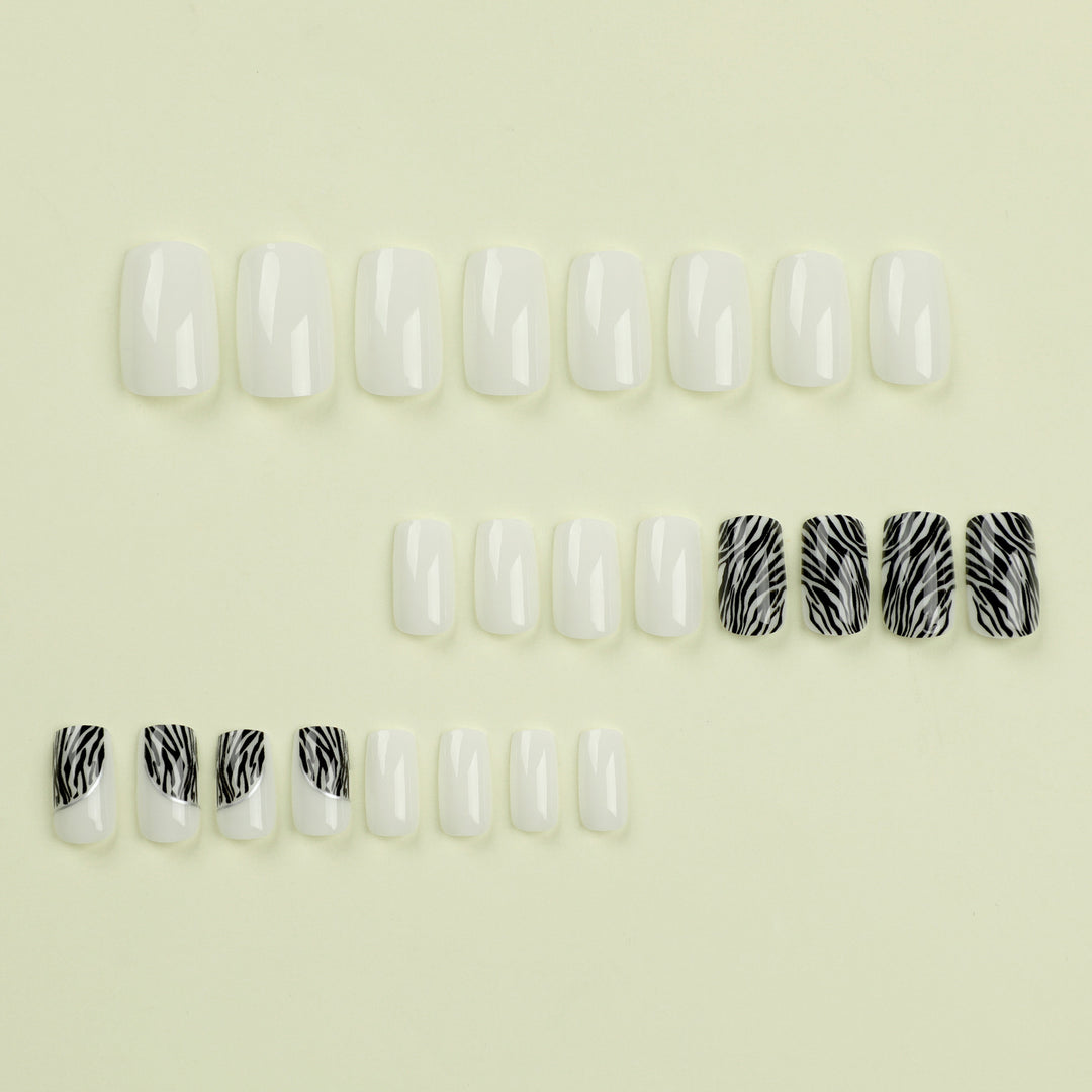 Artful nail extensions with stylish zebra pattern Bowlift
