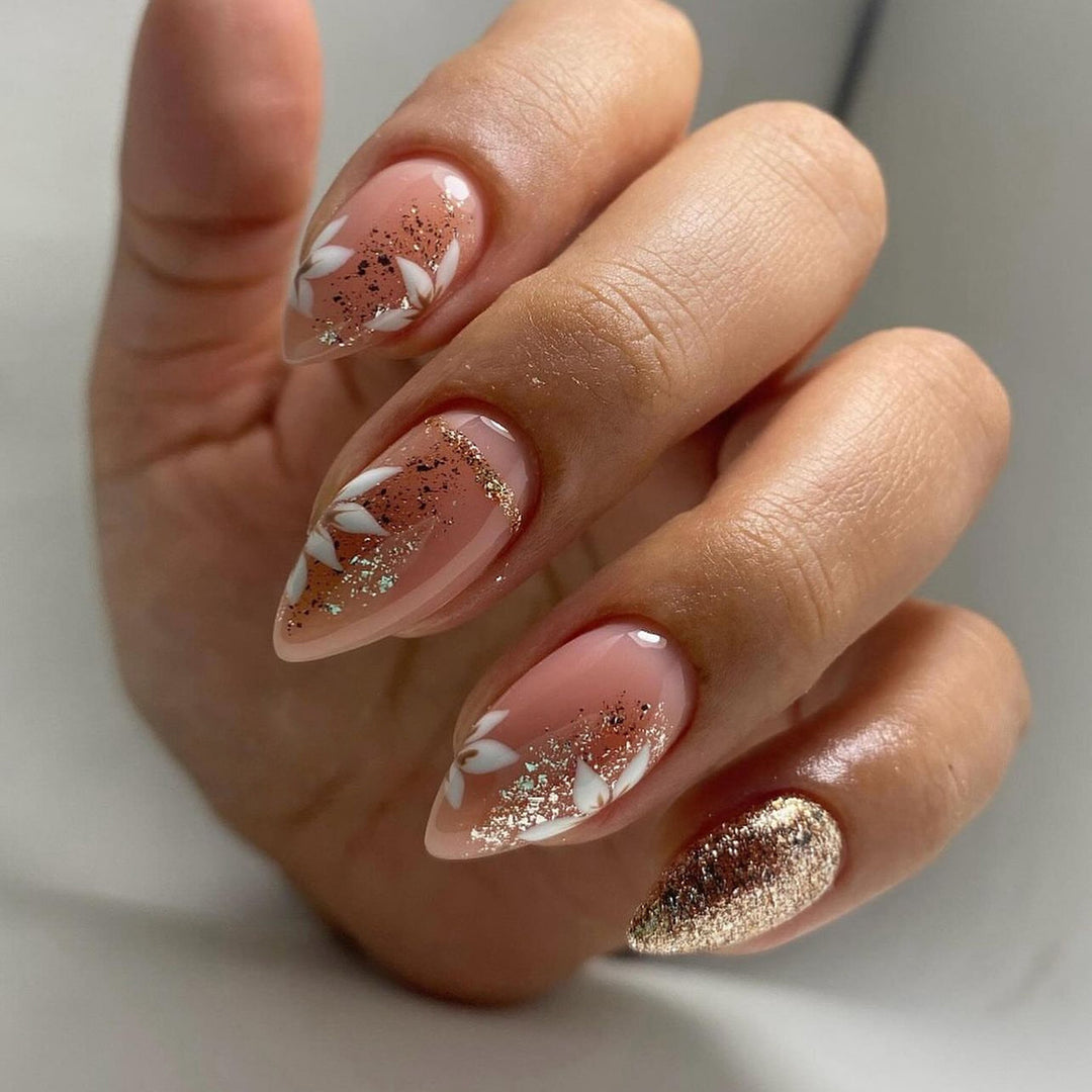 Artistic nail art with floral and glittering accents Bowlift