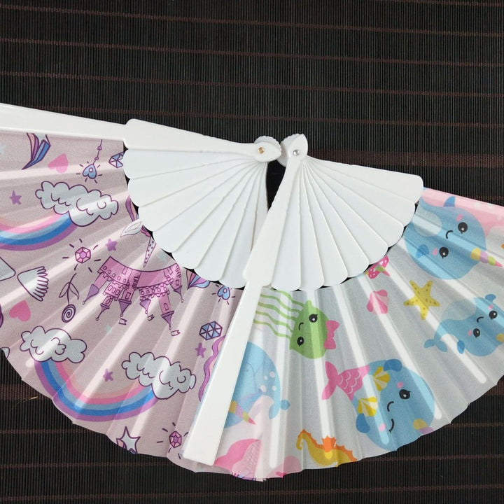 Women folding hand fan with shimmering scale pattern Bowlift