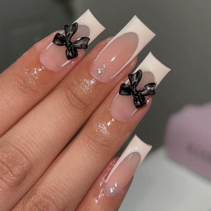 Acrylic nail set with stylish black and pearl details Bowlift