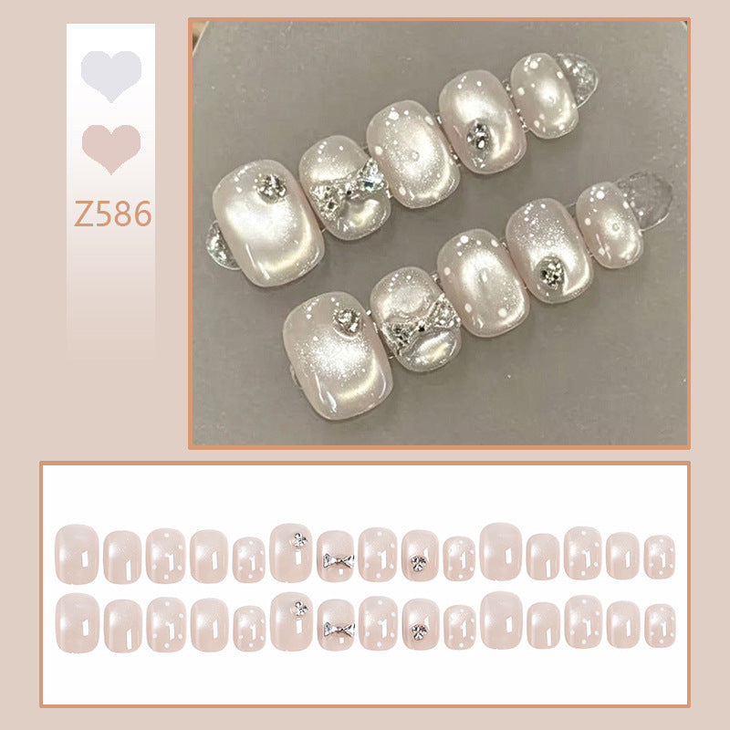Artificial nail set with elegant glitter and crystal decorations Bowlift