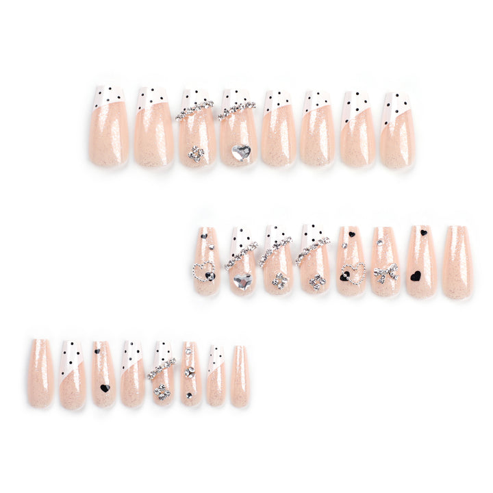 Artful nail extensions with elegant rhinestone and heart designs Bowlift