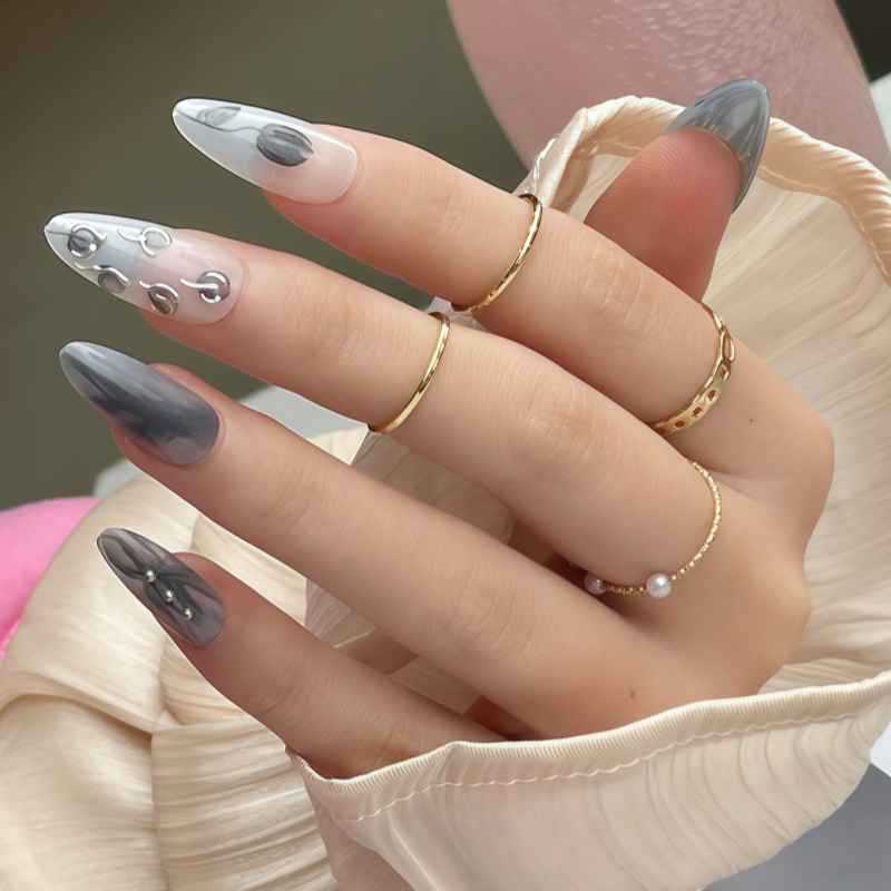 Artistic Stiletto Press-On Nail Design with Contemporary Accents Bowlift