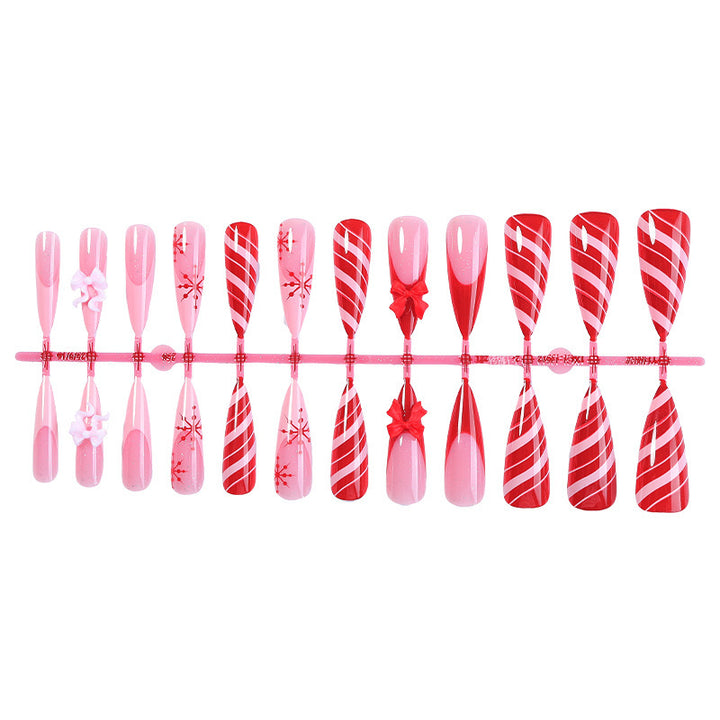 Creative nail art set with festive motifs and embellished accents Bowlift