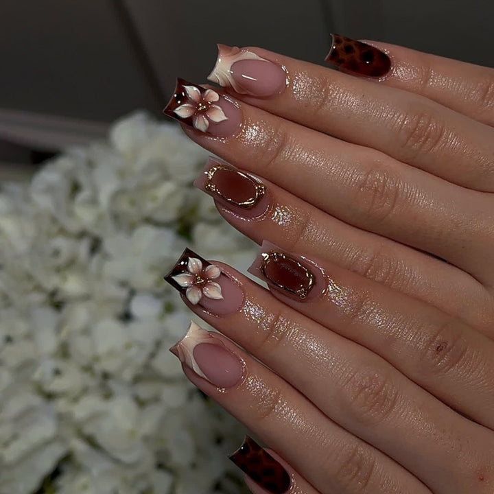 Artistic stiletto nails with elegant floral design and glitter effects Bowlift