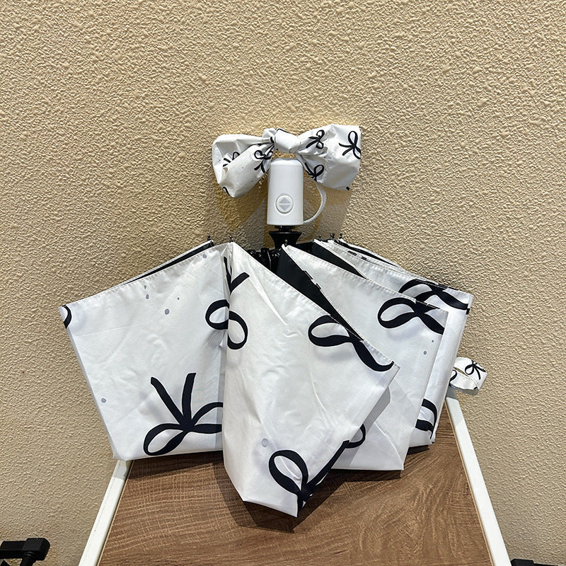 Women's foldable umbrella with elegant bow design Bowlift