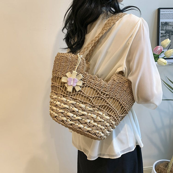 Handwoven beach bag with floral accents Bowlift