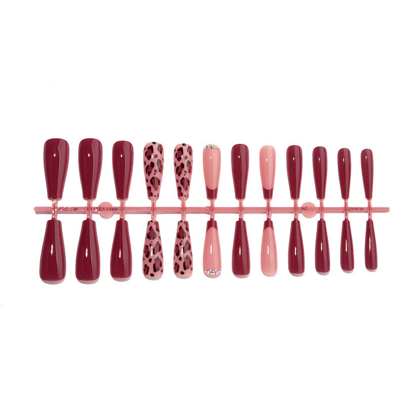 Artificial nail set with elegant animal print and glitter accents Bowlift
