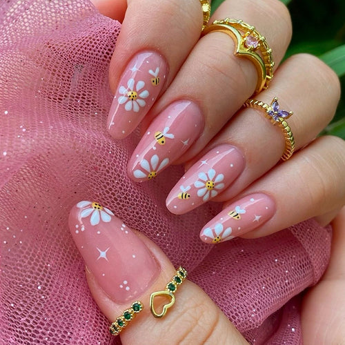 Artificial nails set with elegant flowers and glitter accents Bowlift