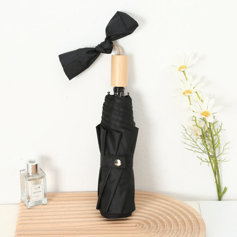 Ladies compact folding umbrella with elegant design and ergonomic wooden handle Bowlift