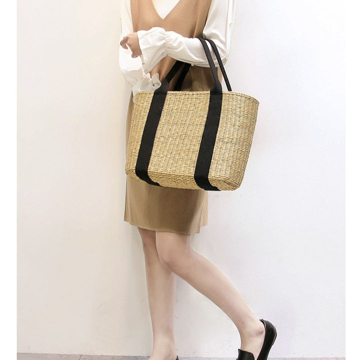 Spacious straw tote bag with comfortable, reinforced handles Bowlift