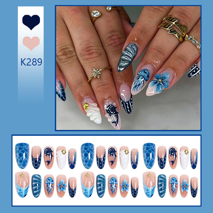 Artificial nails with maritime design and 3D flower accents Bowlift