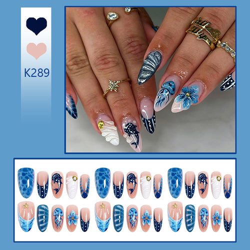 Artificial nails with maritime design and 3D flower accents Bowlift