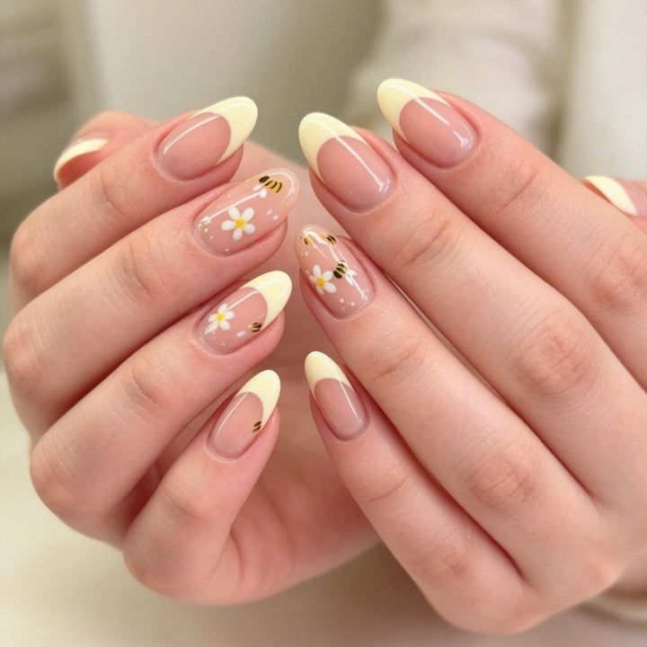Artificial nails with elegant French tip and floral accents Bowlift