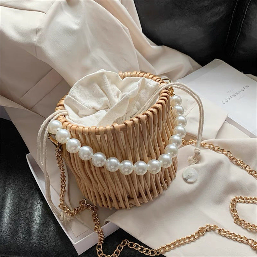 Women’s handbag with elegant pearl handle and braided design Bowlift