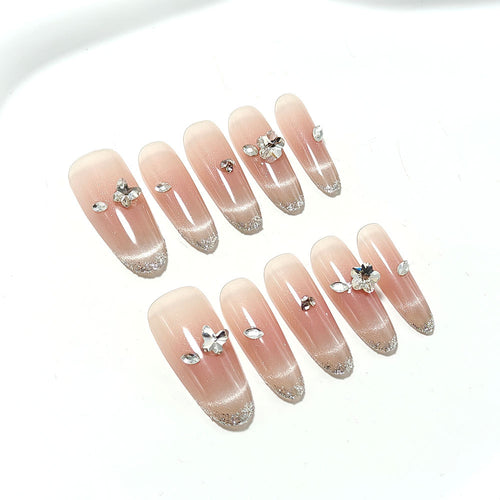 Glamorous artificial nails with glitter decorations Bowlift