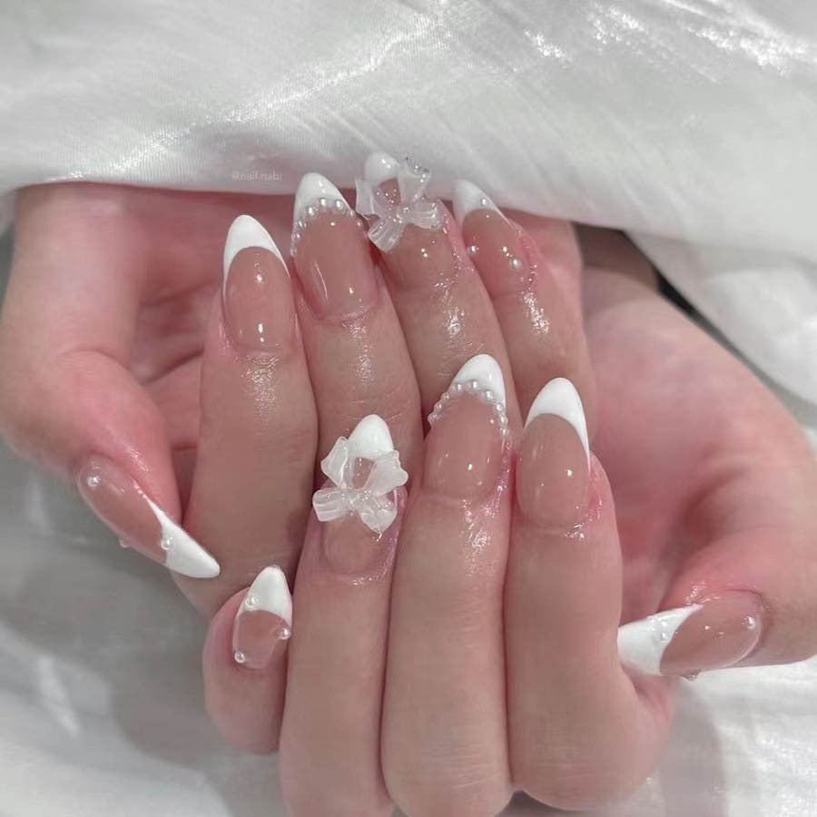 Nail art set with elegant tips and floral accents Bowlift