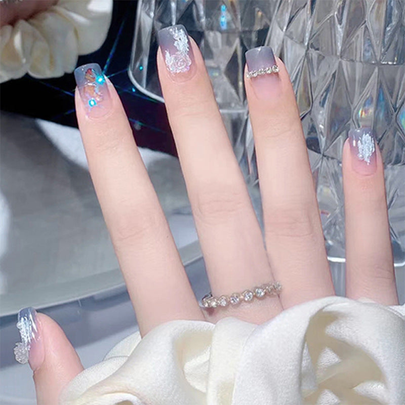 Glamorous artificial nails with heart design and glittering accents Bowlift