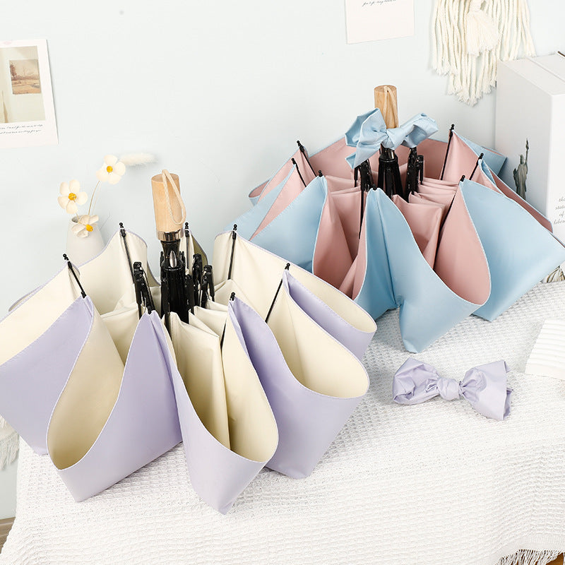 Women compact folding umbrella with stylish design and practical carrying strap Bowlift