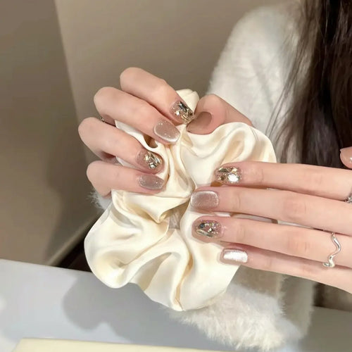 Elegant artificial nails with sparkling gold accents Bowlift