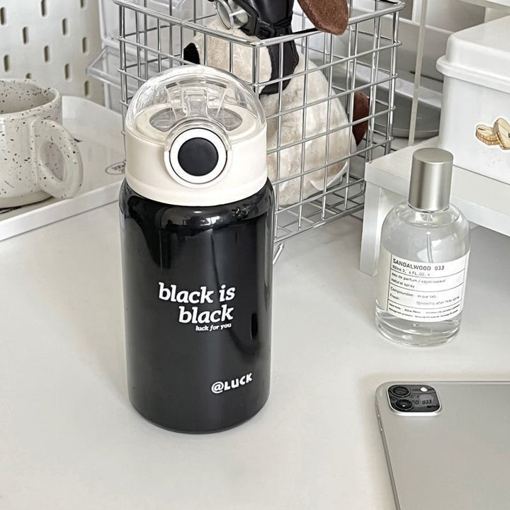 Women's insulated drinking bottle with innovative flip lid and practical handle Bowlift