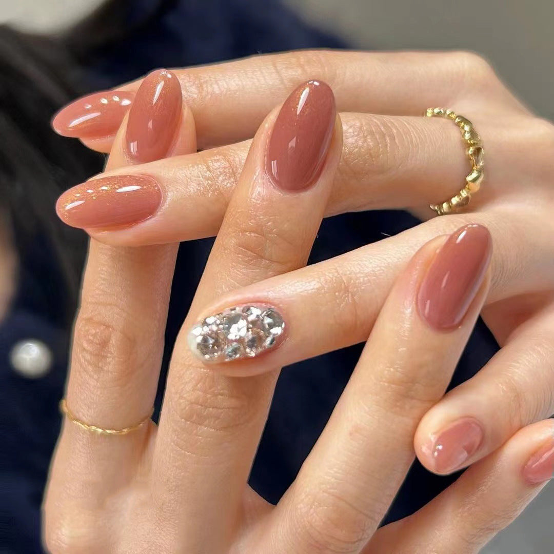 Artistic acrylic nails with glitter accents Bowlift