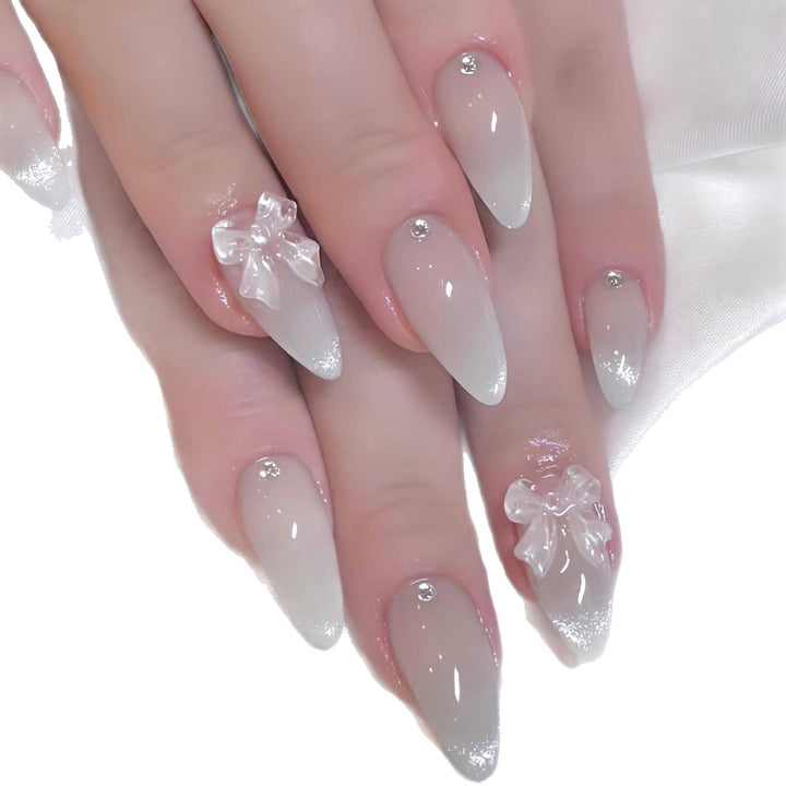 Elegant Stiletto-Shaped Press-On Nails with Decorative Bow Accents Bowlift