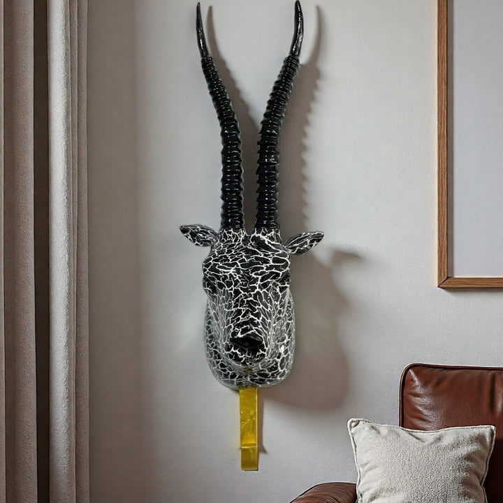Wall hooks in the shape of a stylized unicorn Bowlift