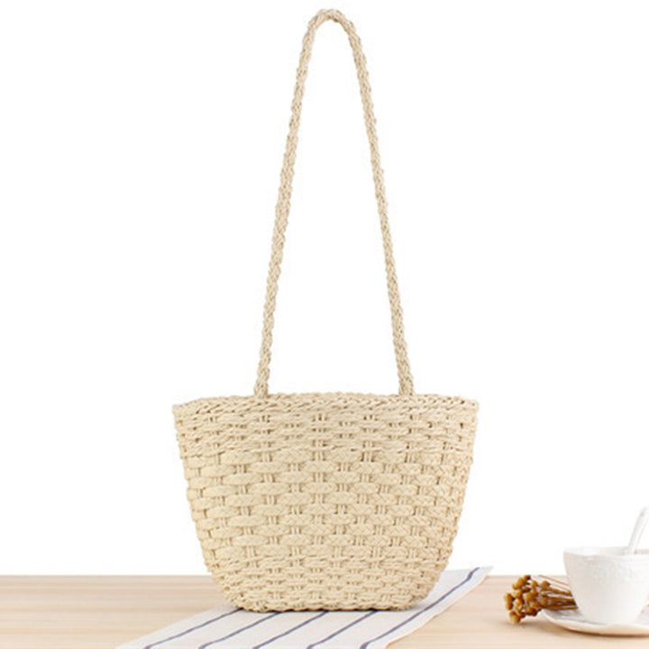 Braided handbag made of natural raffia with robust carrying straps Bowlift