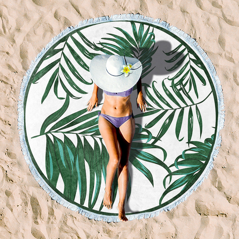 Round beach towel with tropical leaf print and fringe decoration Bowlift