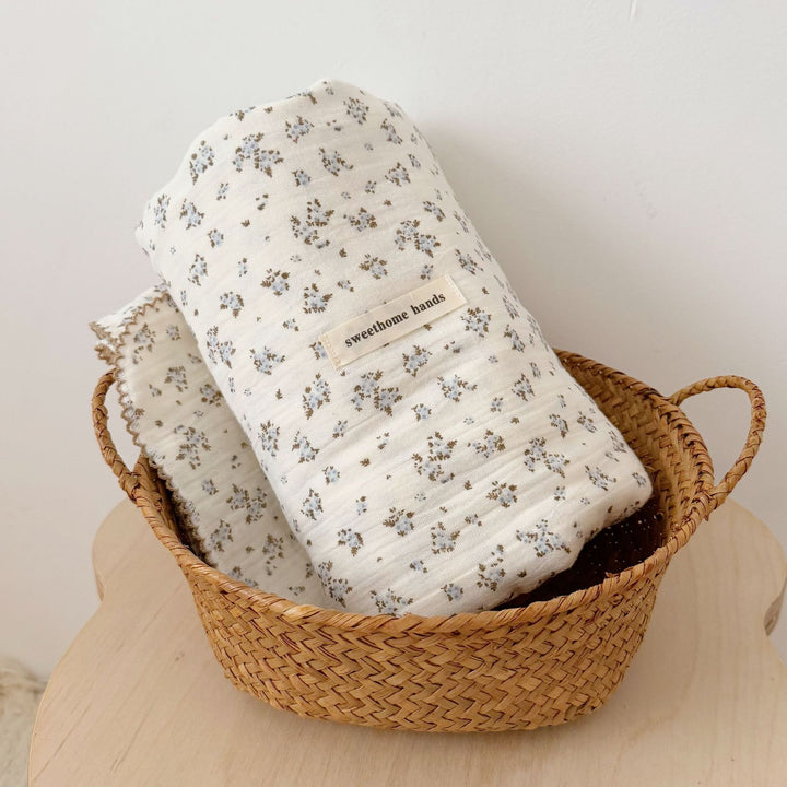 Unisex Muslin Blanket with delicate floral design and elegant ruffles Bowlift