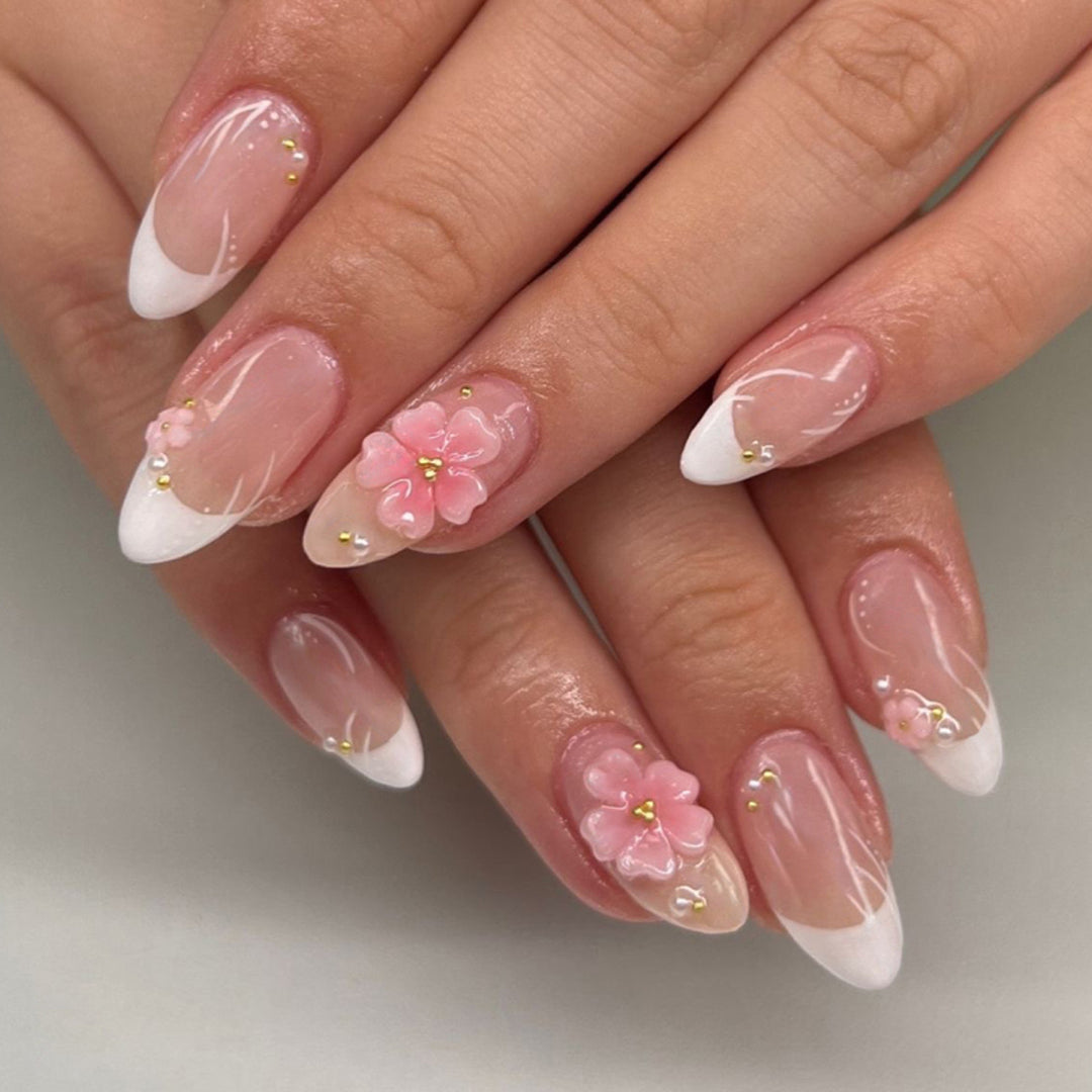 Artful stiletto nails with elegant floral design and glitter details Bowlift