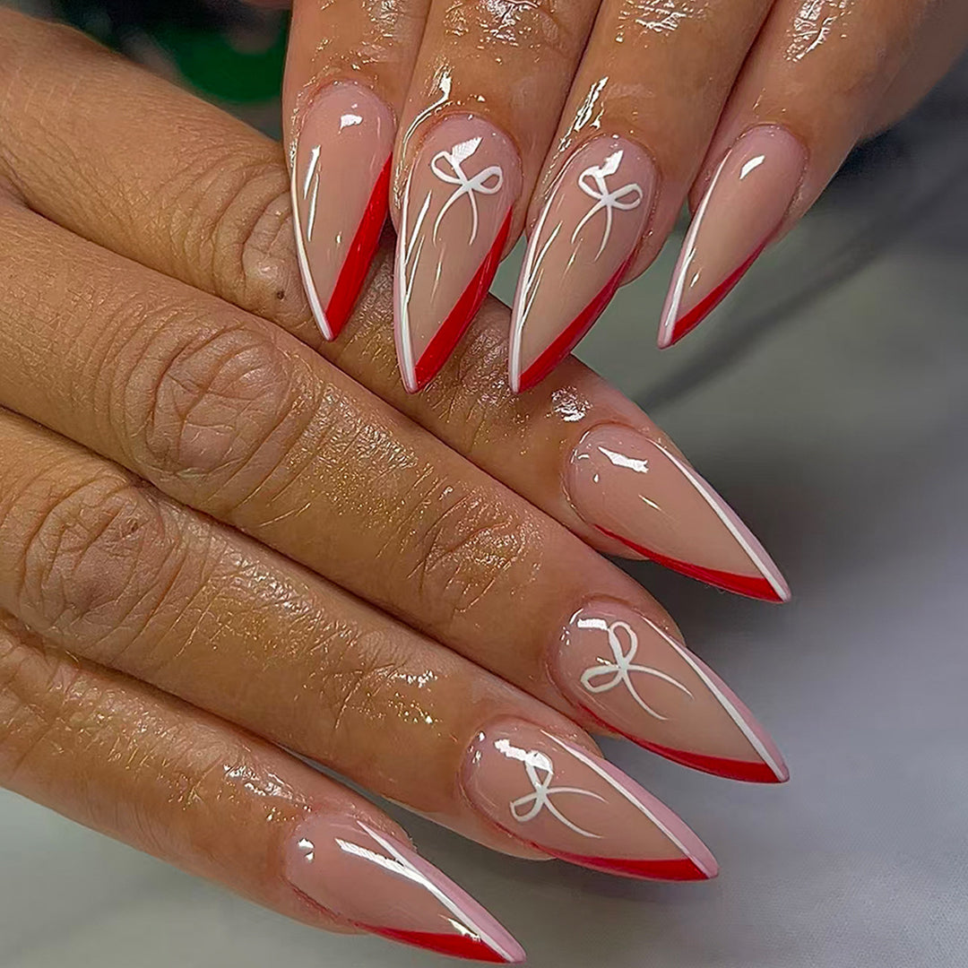 Artificial nails in elegant stiletto design with bow accents Bowlift