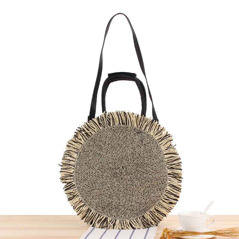 Round Bast shoulder bag with fringes and leather handles Bowlift