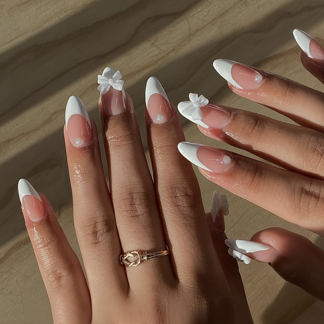 Acrylic nail set with elegant tips and floral accents Bowlift
