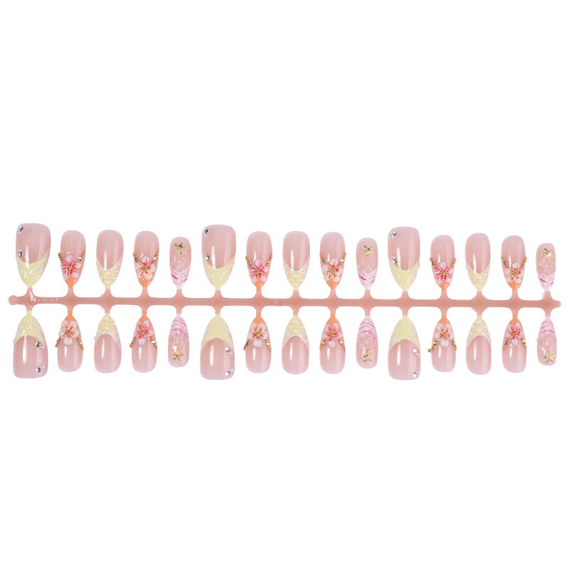 Artificial nail set with glamorous floral and glitter decorations Bowlift