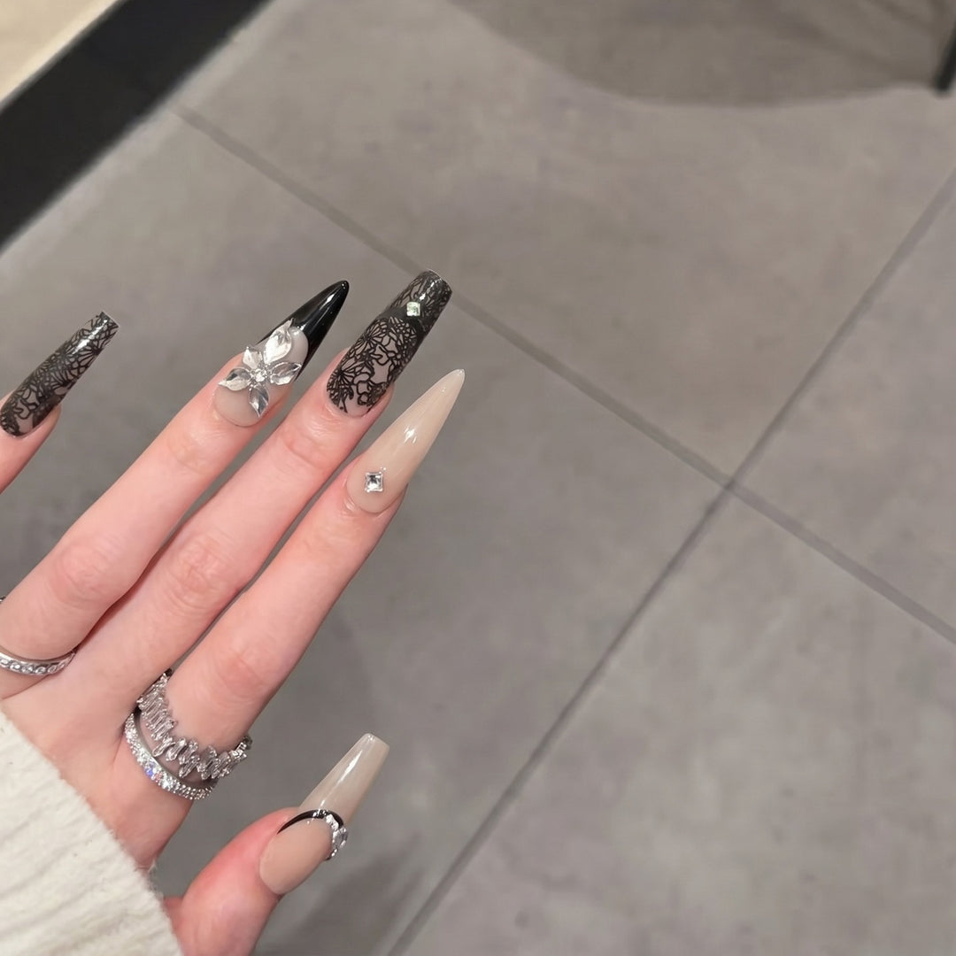 Artistic Stiletto Press-On Nail Set with Floral and Geometric Accents Bowlift