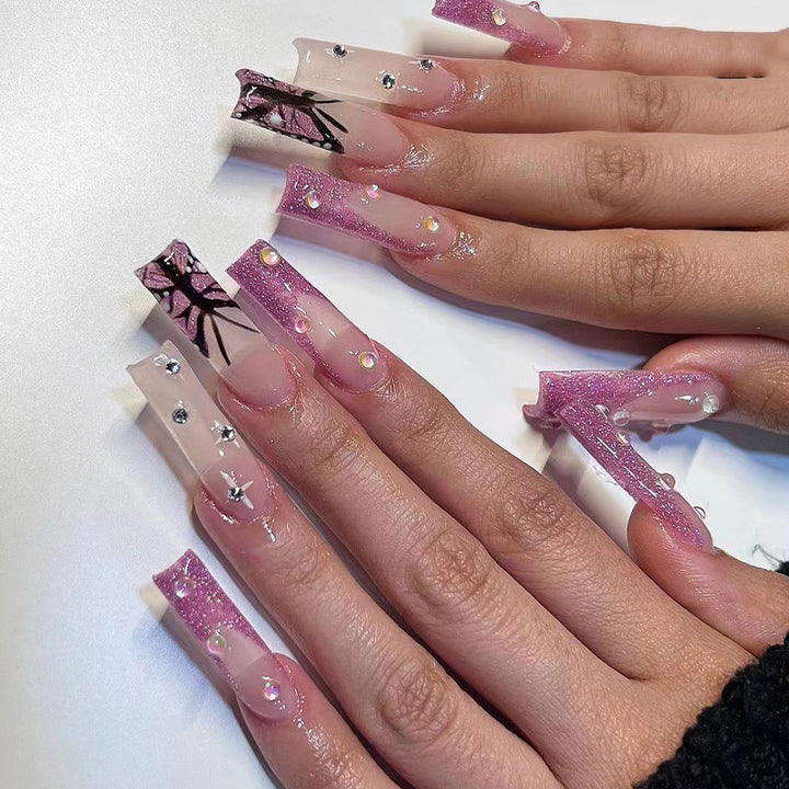 Artful stiletto nails with floral and glittering accents Bowlift