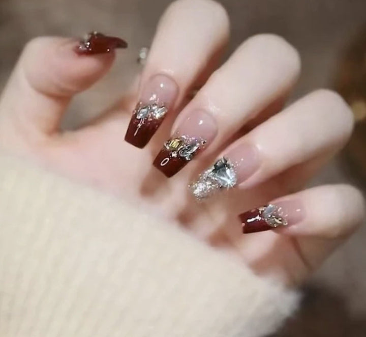 Artistic Nail Art with Glitter and Flower Applications Bowlift