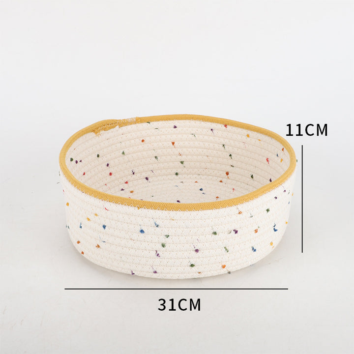 Storage basket made of natural cotton fabric with colorful dots