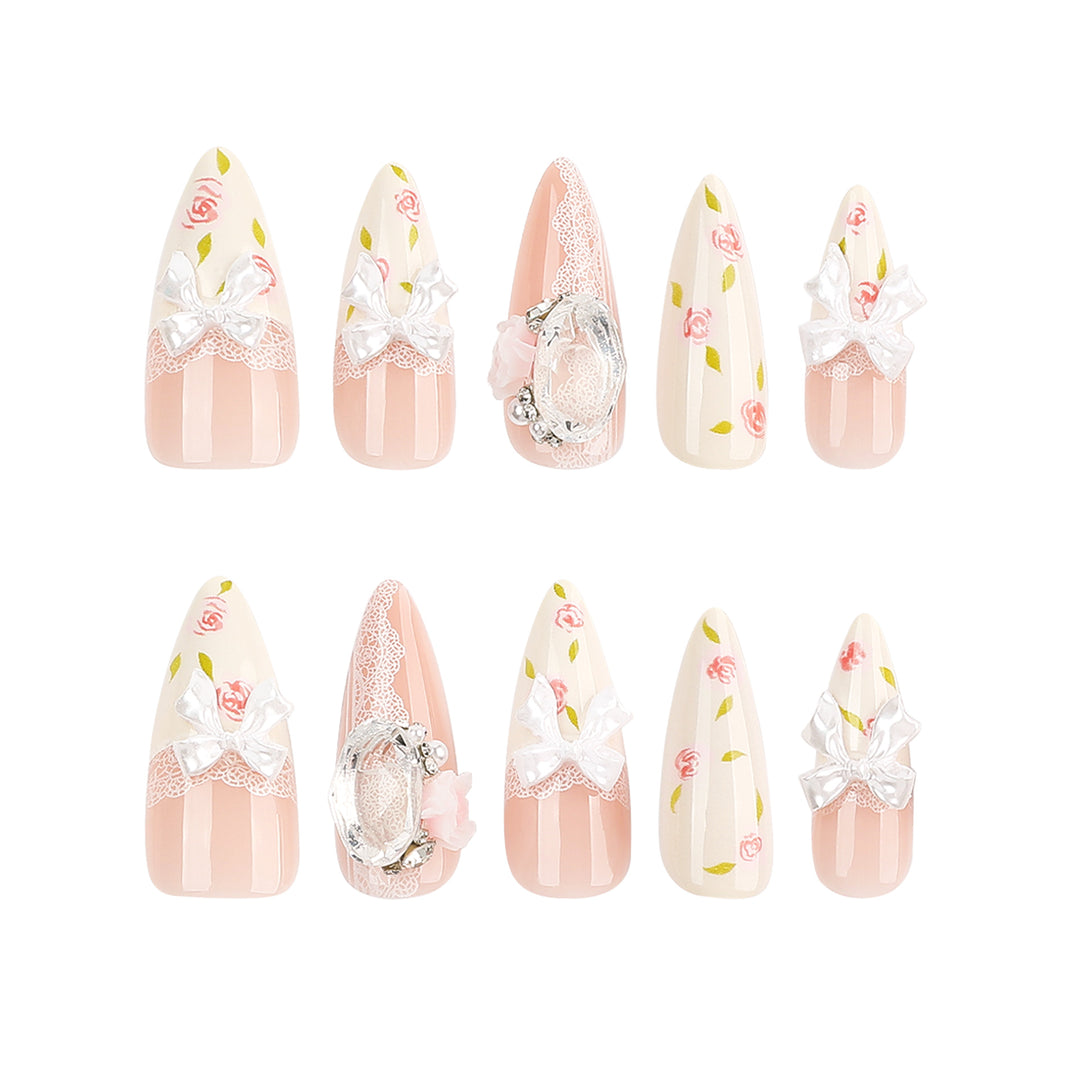 Artful stiletto nails with floral accents and glitter accents Bowlift