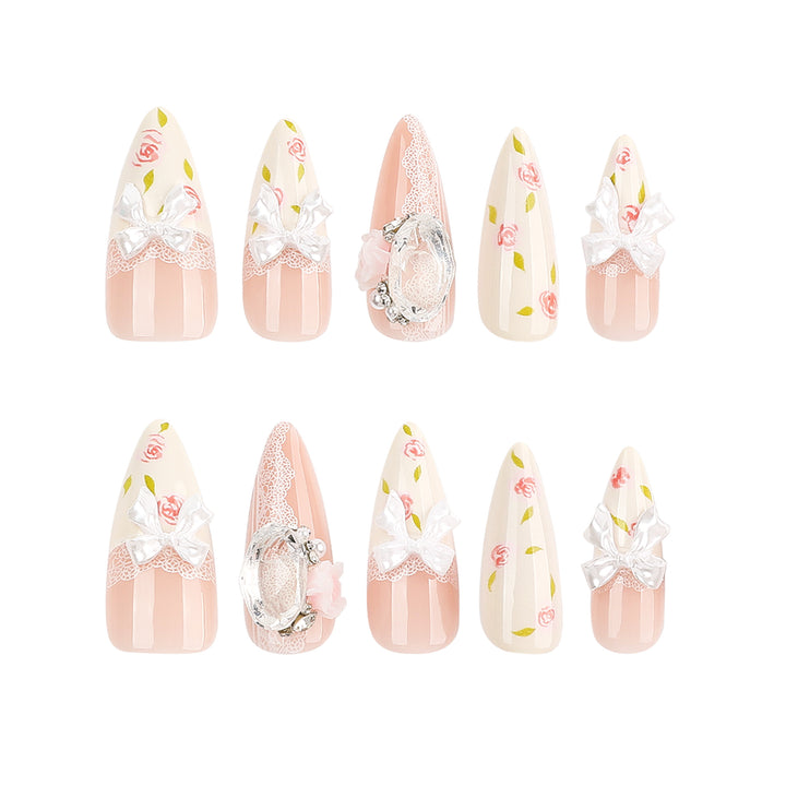 Artful stiletto nails with floral accents and glitter accents Bowlift